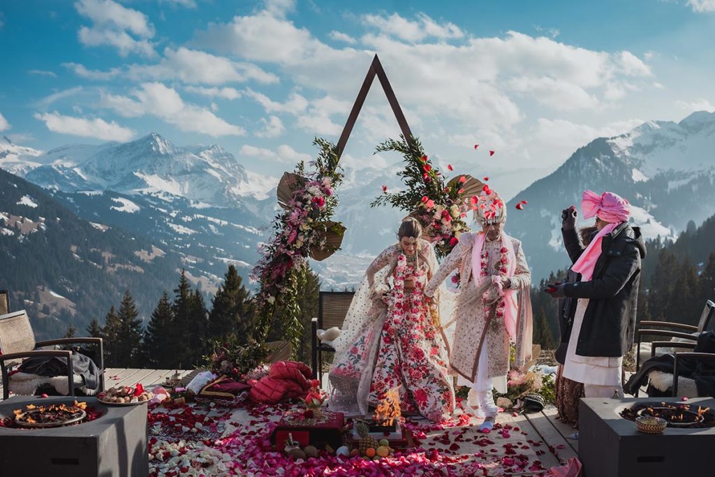 Outdoor mountaintop Indian destination wedding ceremony held at the Alpina Gstaad, Gstaad, Switzerland.