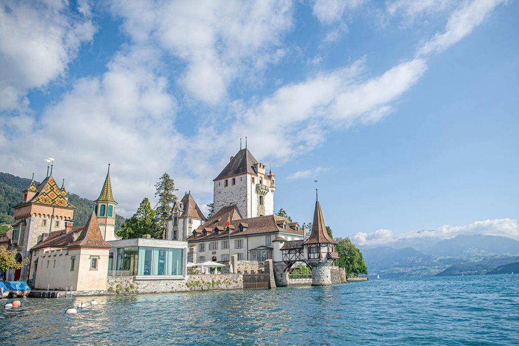 Image of Schloss Oberhofen with Lake Thun in the foreground.
