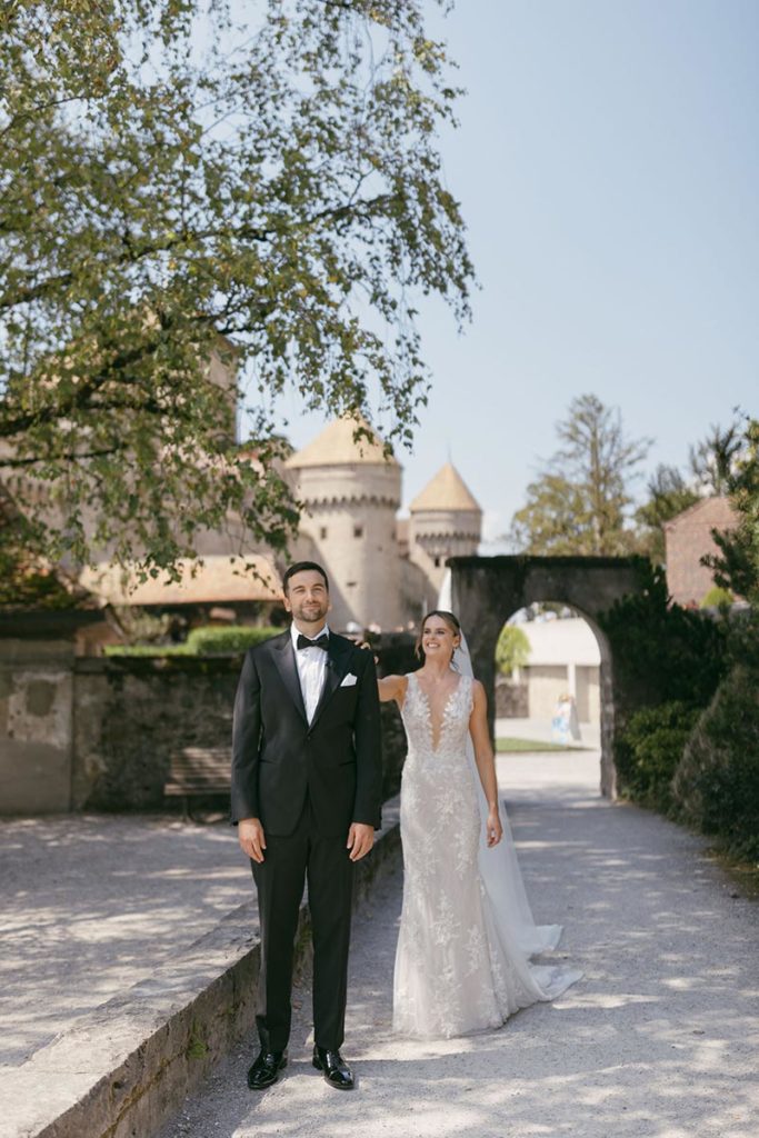  Bride and groom “first look” photo in front of Château de Chillon, a medieval island fortress on Lake Geneva.