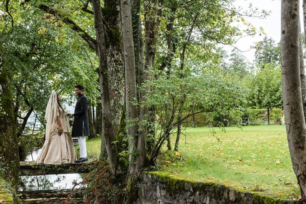 Indian bride and groom enjoy a private moment together on the grounds of the Victoria Jungfrau Hotel in Interlaken, Switzerland