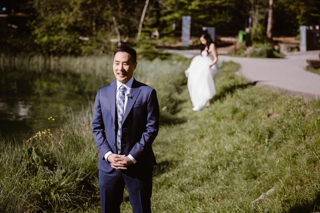 First look image on the shores of Lake Oeshinensee, taken during their Swiss elopement.