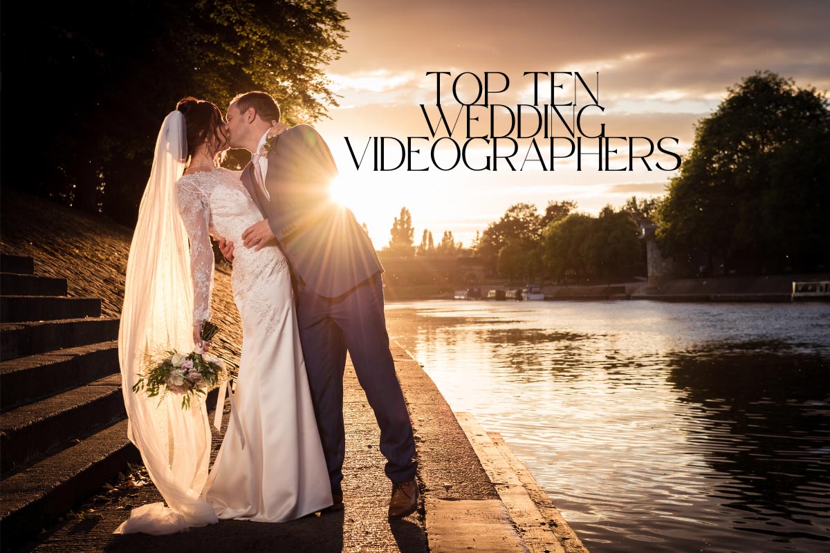 A bride and groom kiss on the side of a river with the caption Top Ten Wedding Videographers across the image